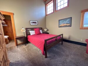 A clean made-up bed in a vacation rental bedroom in Breckenridge for the blog, Sleep Smarter: The Benefits of Professional Mattress Cleaning Service in Breckenridge