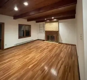 an empty room with professionally cleaned hardwood floors in a summit county condo